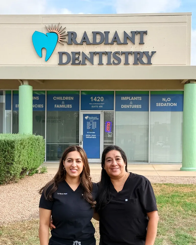 Dr. Richa Wahi with a member of the team outside Radiant Dentistry ATX on Wells Branch Parkway
